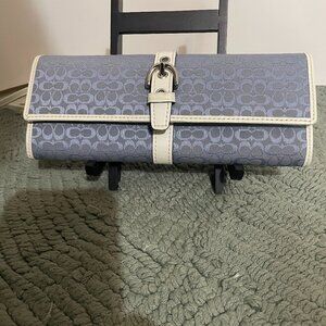 Vintage Blue Logo Coach Wristlet with white strap and buckle. Snap Closure